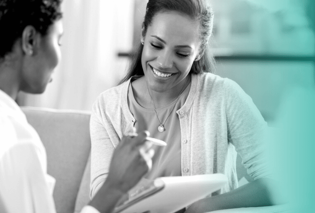 woman helping a student through career guidance and smiling